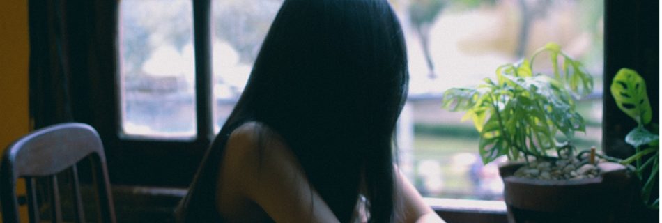 Girl sitting at table
